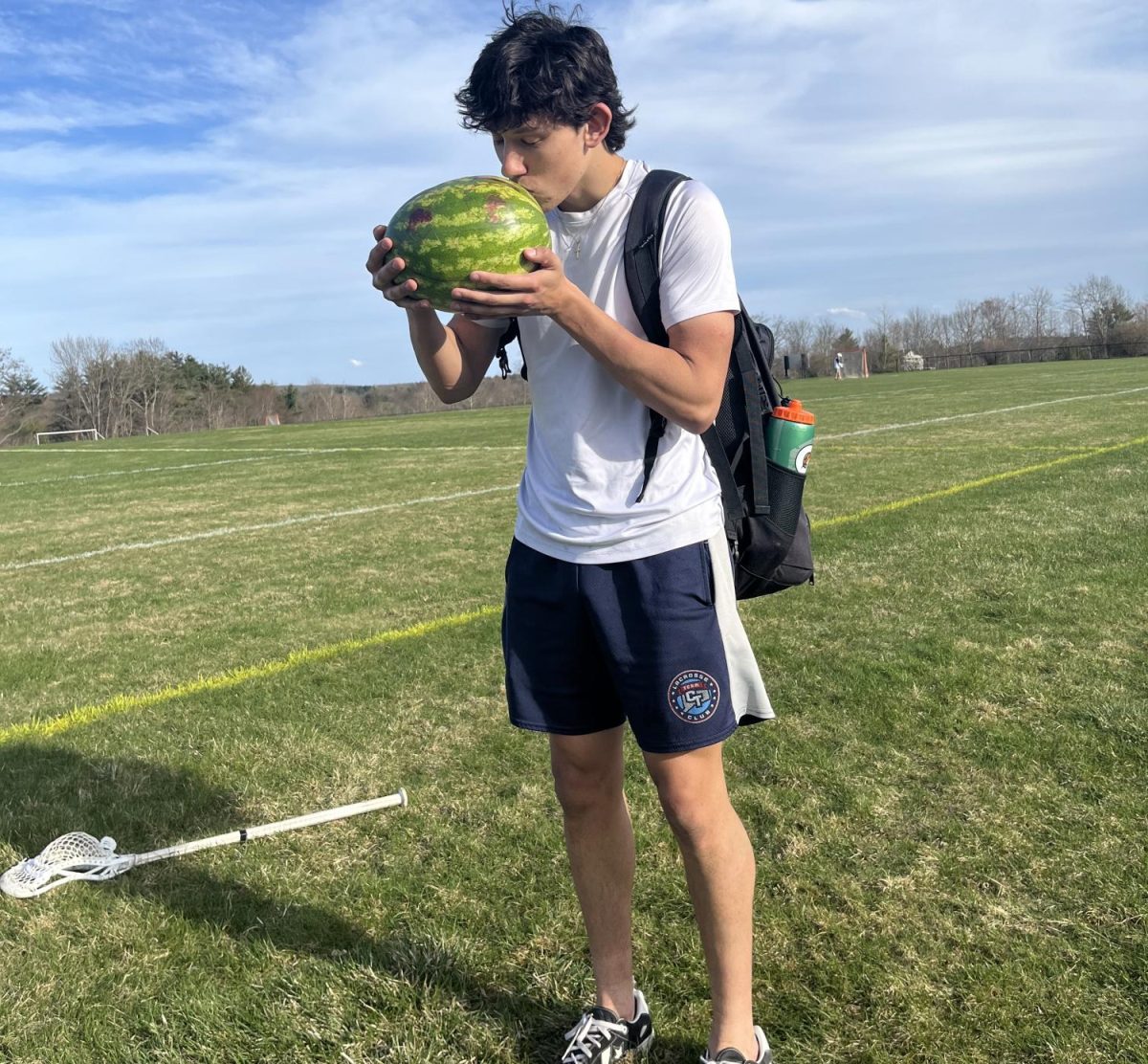 NHS senior Liam Sandor poses with his still intact watermelon as the senior assassin game comences. This year’s rendition of the game, though not school affiliated, has added in several new procedures to ensure that this spring’s competition can begin safely. 