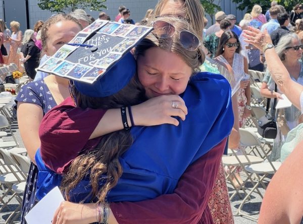 Nonnewaug graduate Emma Cummings, left, and Kyleigh Paige embrace in a hug at Nonnewaug's 2024 graduation. (Courtesy of Emma Cummings)