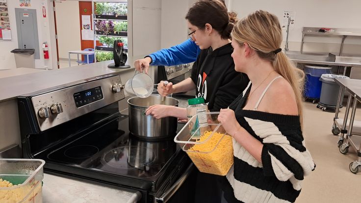 NHS advanced culinary class prepares mac and cheese with cheddar and parmesan. Cheese is a large part of culture-both in Nonnewaug and America and it's clear that NHS students simply can't live without it. 