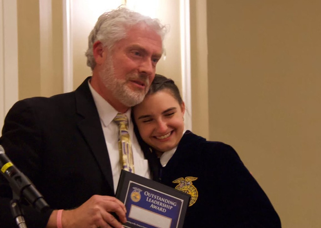 Floriculture teacher Eric Birkenberger, left, awards Samantha Kostka an award at the Woodbury FFA banquet. (Courtesy of the Woodbury FFA/Instagram)