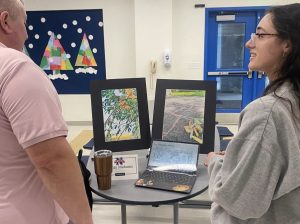 Lily Matozzo, a class of 2024 graduate, presents her MBLE presentation to Toby Denman at the winter MBLE showcase January 24, 2024. Students had the opportunity to share their passions and interest to NHS faculty, however, for the class of 2027 and beyond, students no longer have to participate in the MBLE. (Courtesy of Nonnewaug High School Instagram)
