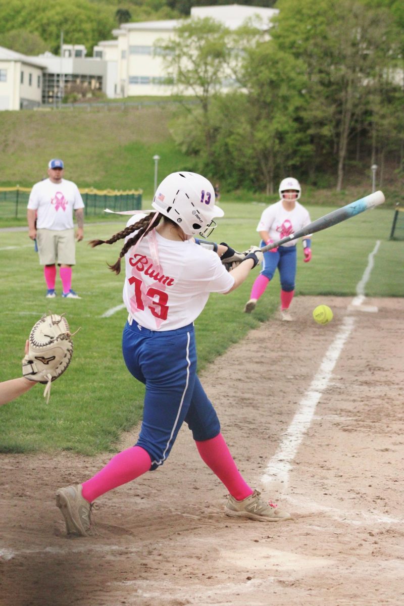Nonnewaug freshman Ashlynn Blum hits the ball during the NHS softball game on May 9. 