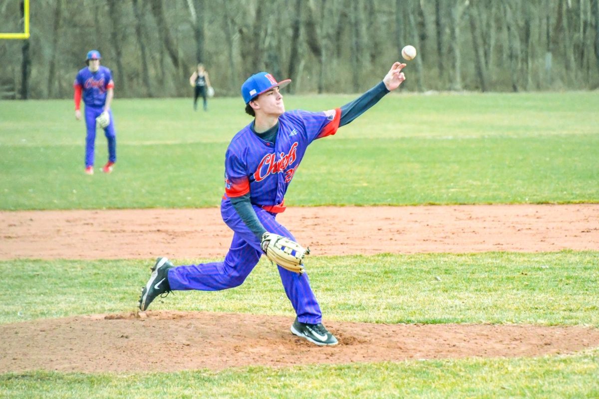 Freshman Patrick Martinetto (20) pitches in a scrimmage against Holy Cross. Baseball pitchers typically can't pitch every day. (Deme Jones '26)