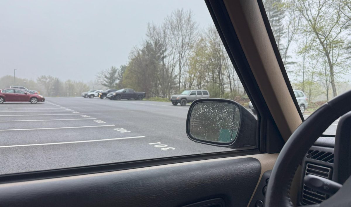 Elsie Crocco's view from the Nonnewaug parking lot in the morning includes a steadily busier traffic scene with loud music and honking.
