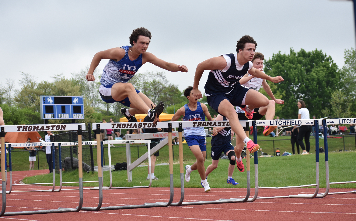Senior Thomas Lengyel races in the 100 m hurdles against Shepaug at BLs on May 17 in Litchfield. (Audrey Doran '27)