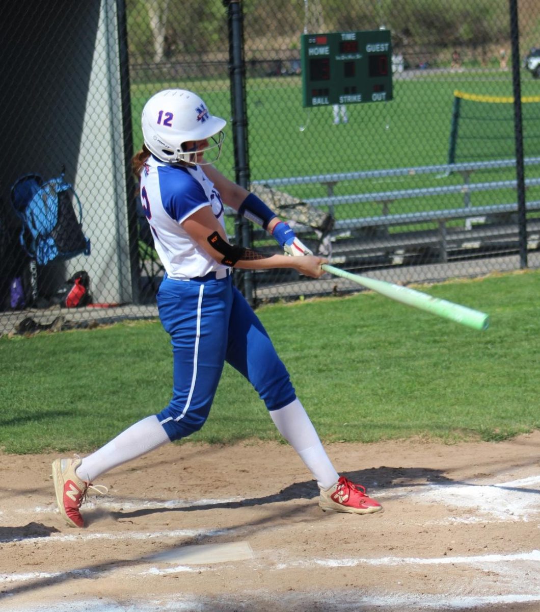 Junior captain Jade Rinaldi steps up to the batter's box and swings at a ball during the game against Terryville on April 23.