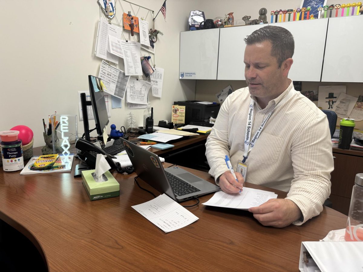 Nonnewaug counselor Paul Laedke reviews students 504 plans brought up by parents to help students better their learning environment.