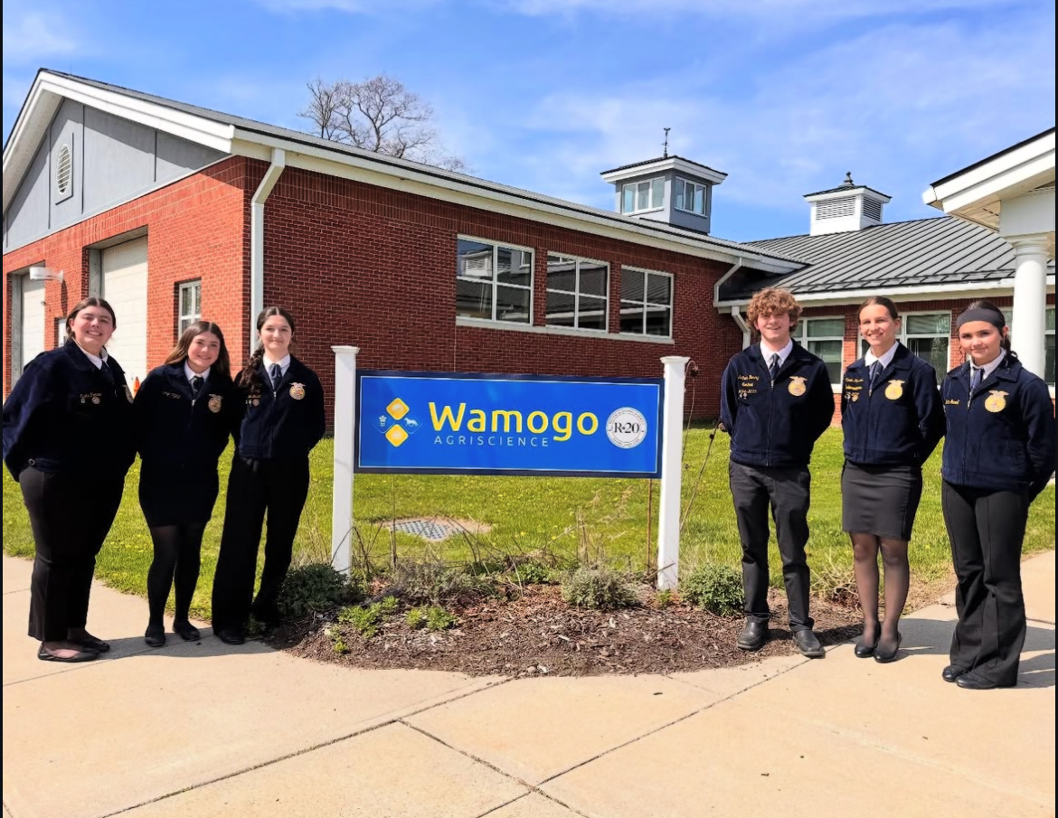 The Woodbury FFA's Parliamentary Procedure team, from left, Elsie Crocco, Riley Amaral, Merije Iljazi, Nate Berry, Nicole Perssico, and Charlotte Gowell pose together in front of the Wamogo FFA sign after their competition on May 1. (Courtesy of the Woodbury FFA/Instagram)
