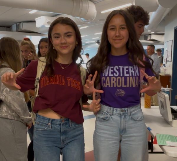 Nonnewaug seniors Eva Ripperger, left, and Karisa Ciszauskas show off their college T-shirts for National College Decision Day on May 1.