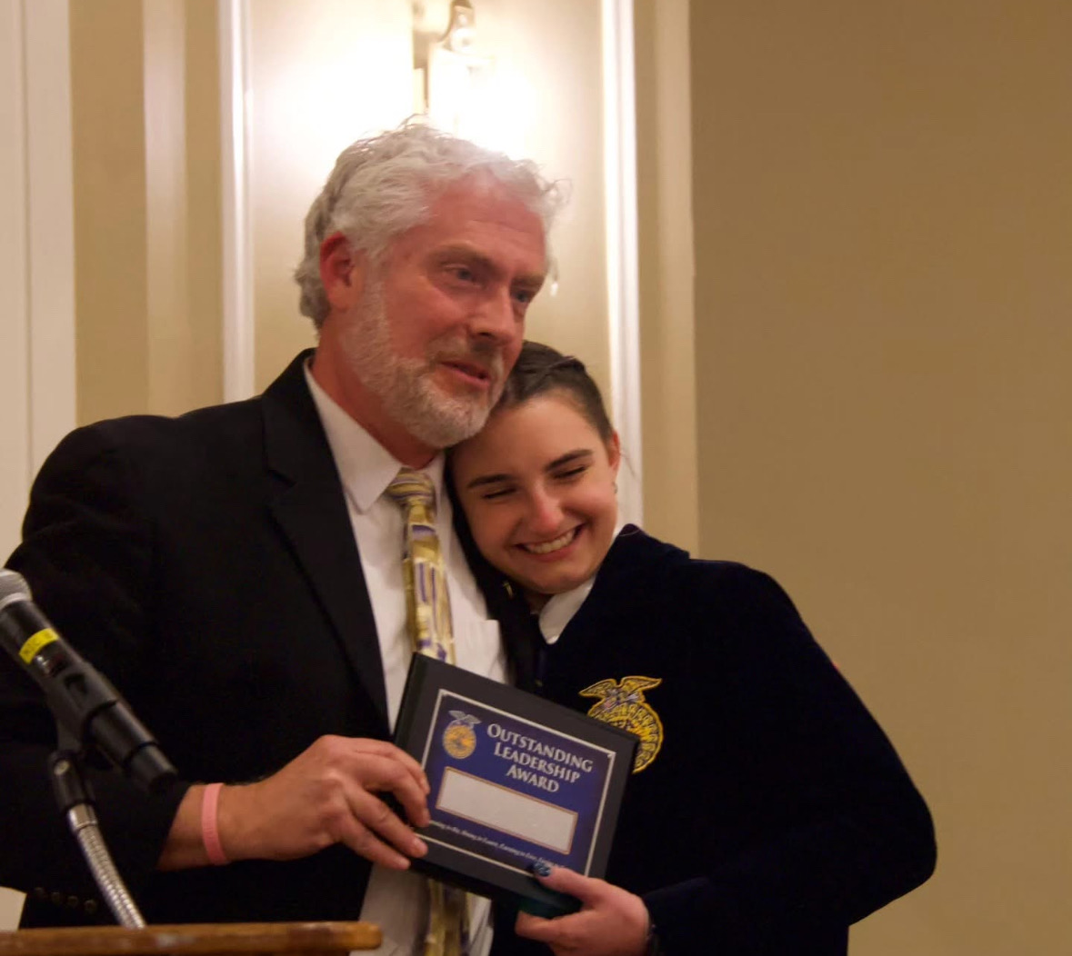 Samantha Kostka closes off her term at banquet last year with chapter team advisor Eric Birkenberger. Banquet is a time to look back on the achievements of the year and it is clear Kostka is joyous about the chapters accomplishments under her presidency. (Courtesy of Woodbury FFA/Instagram)