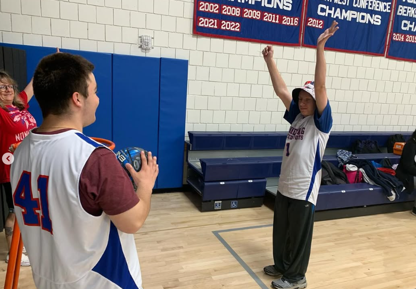 NHS junior James Gwiazdowski and senior Logan Grant celebrate together during yesterday's Unified-Special Olympics game. Gwiazdowski is one of many NHS juniors who's juggling a busy spring semester filled with sports, high-stakes testing, and core academic classes. Photo Credit: NHS Instagram