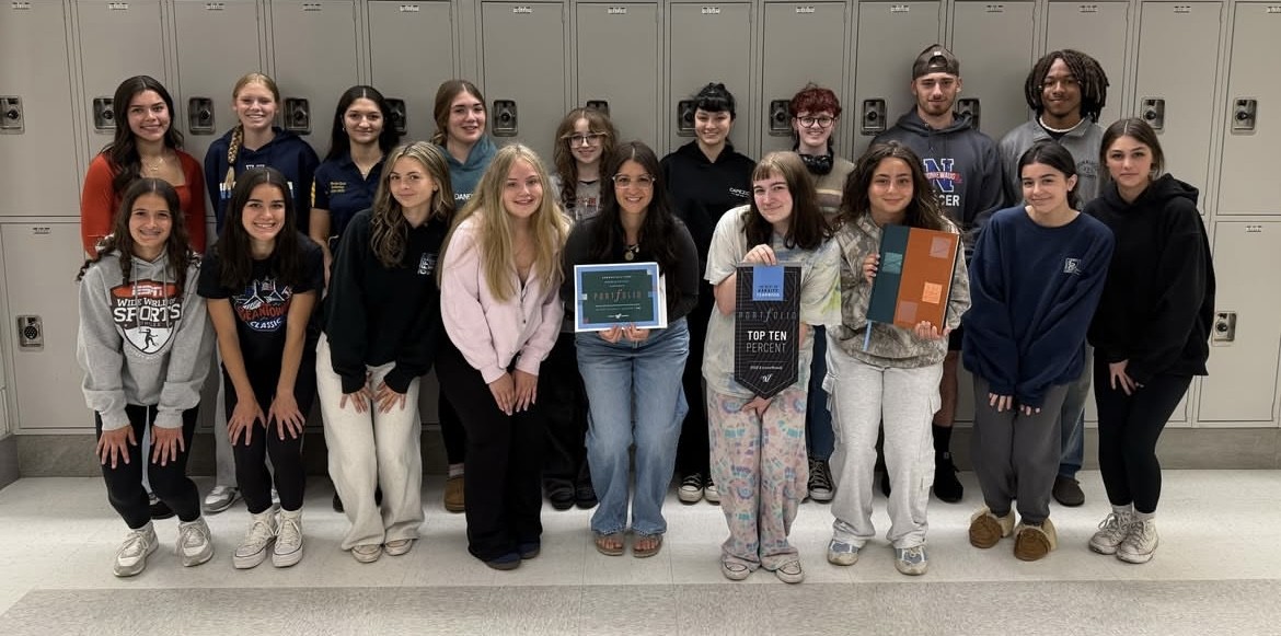 The Nonnewaug yearbook staff poses after winning an award for the 2024 yearbook, "See You On The Hip Side," which was included in the Varsity Portfolio publication among the top 10% of yearbooks by the company. (Courtesy of Region 14/Instagram)