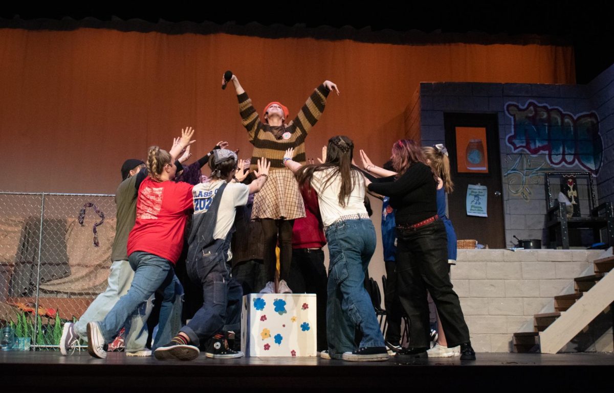 Claire Roger poses with perfection as the drama club gathers around her in this spring’s performance of Godspell. The dedication and life brought to the show could not be possible without their practice, focus, and teamwork. (Courtesy  of Lila Rogers).