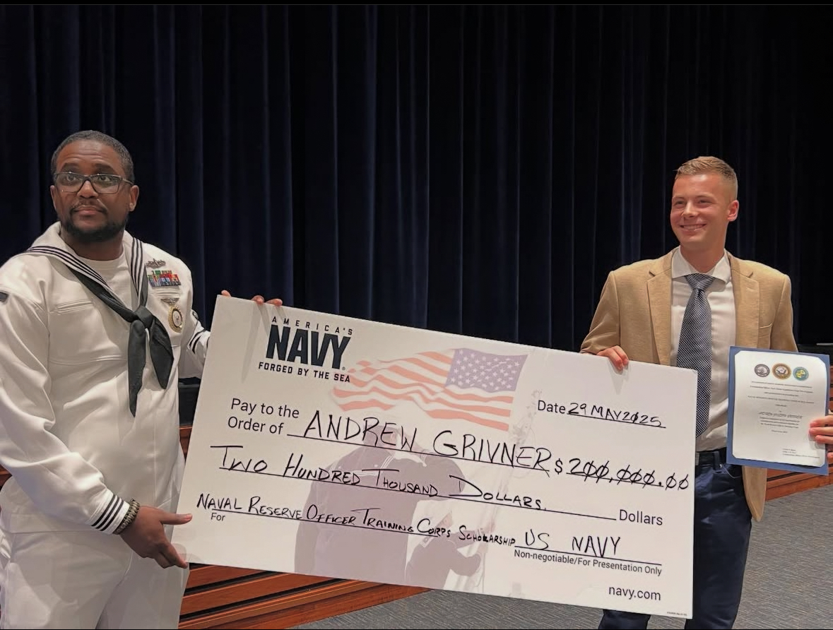 Nonnewaug senior Andrew Grivner, right, holds his Naval Reserve Officer Training Corps Scholarship, a $200,000 award, awarded to him on May 29 at the Nonnewaug awards ceremony. A unique selection of U.S. Navy and Marine Corps awards were given, as well as other scholarship awards that make Nonnewaug's award ceremony stand out. (Courtesy of Nonnewaug High School/Instagram)