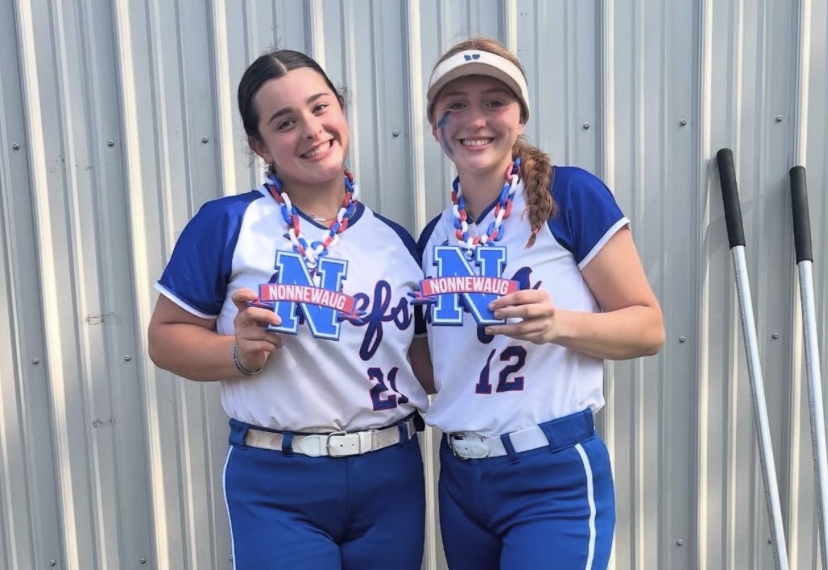 Junior captain Jade Rinaldi and freshman Gianna DeLorenzo pose after hitting home runs in a 26-0 game against CREC Aerospace/Bloomfield on June 2. (Courtesy of Nonnewaug softball/Instagram)
