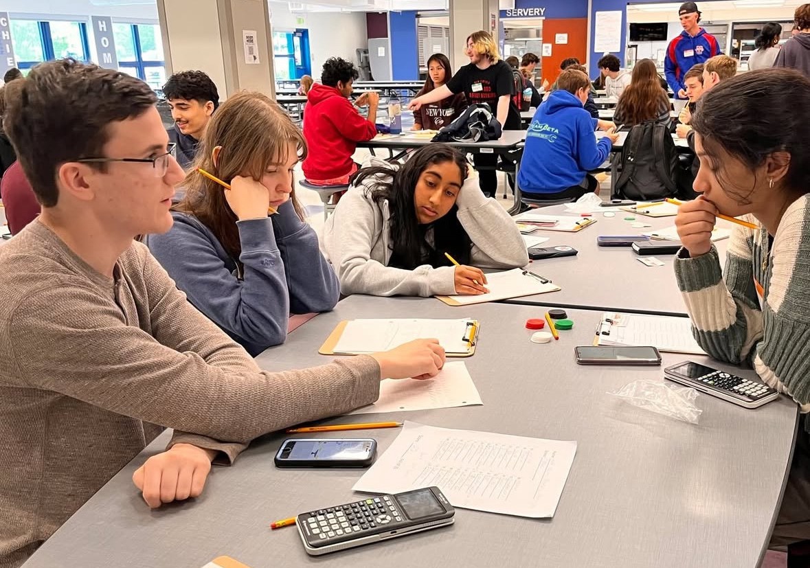 Math Day students separate into groups to collaborate with peers from different schools to solve a puzzle. Students can build bonds and challenge themselves simultaneously. (Courtesy of Region 14/Instagram) 