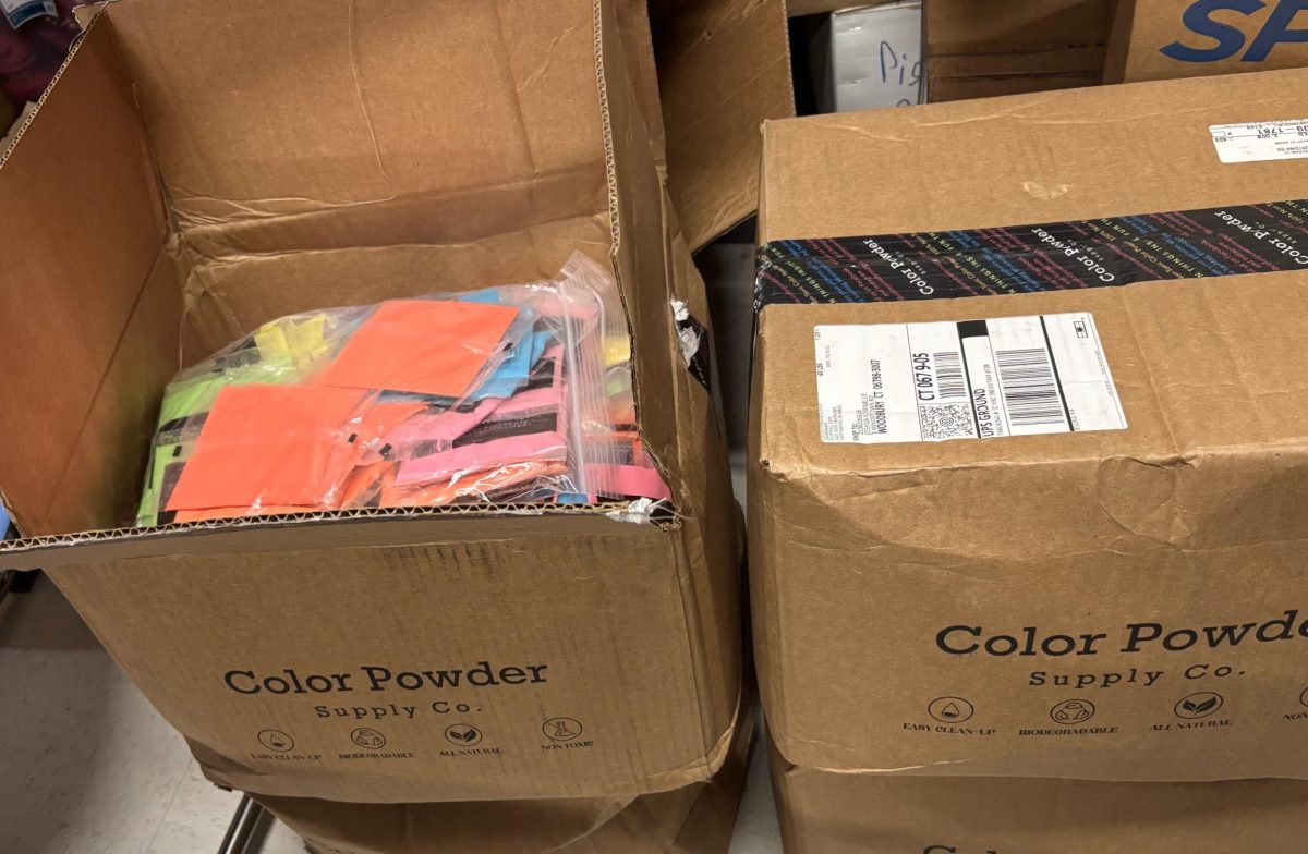 Boxes of unused packets of colored powder sit in the Student Council storage closet after the Color Wars event was canceled. More than 900 packets of color lay dormant, waiting for next year.