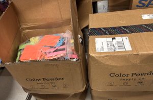 Boxes of unused packets of colored powder sit in the Student Council storage closet after the Color Wars event was canceled. More than 900 packets of color lay dormant, waiting for next year.