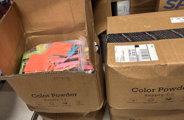 Boxes of unused packets of colored powder sit in the Student Council storage closet after the Color Wars event was canceled. More than 900 packets of color lay dormant, waiting for next year.