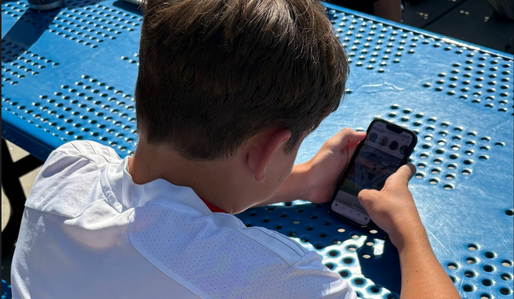 Nonnewaug freshman and varsity soccer player Declan Stankevich uses social media during his lunch period. For NHS' athletes, guidance on social media usage is something coaches speak about at the start of the season. 