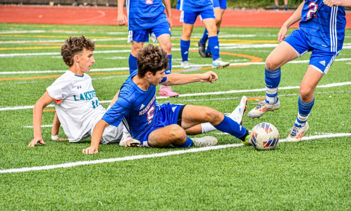 Nesim Iljazi (5) slide tackles his opponent on Sep. 5 against the Lakeview Bobcats. The Chiefs won 2-0.