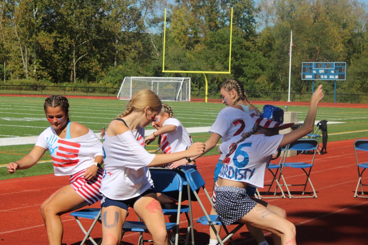 On September 26th the "Founding Mothers" compete in a game of musical chairs during senior field day. 