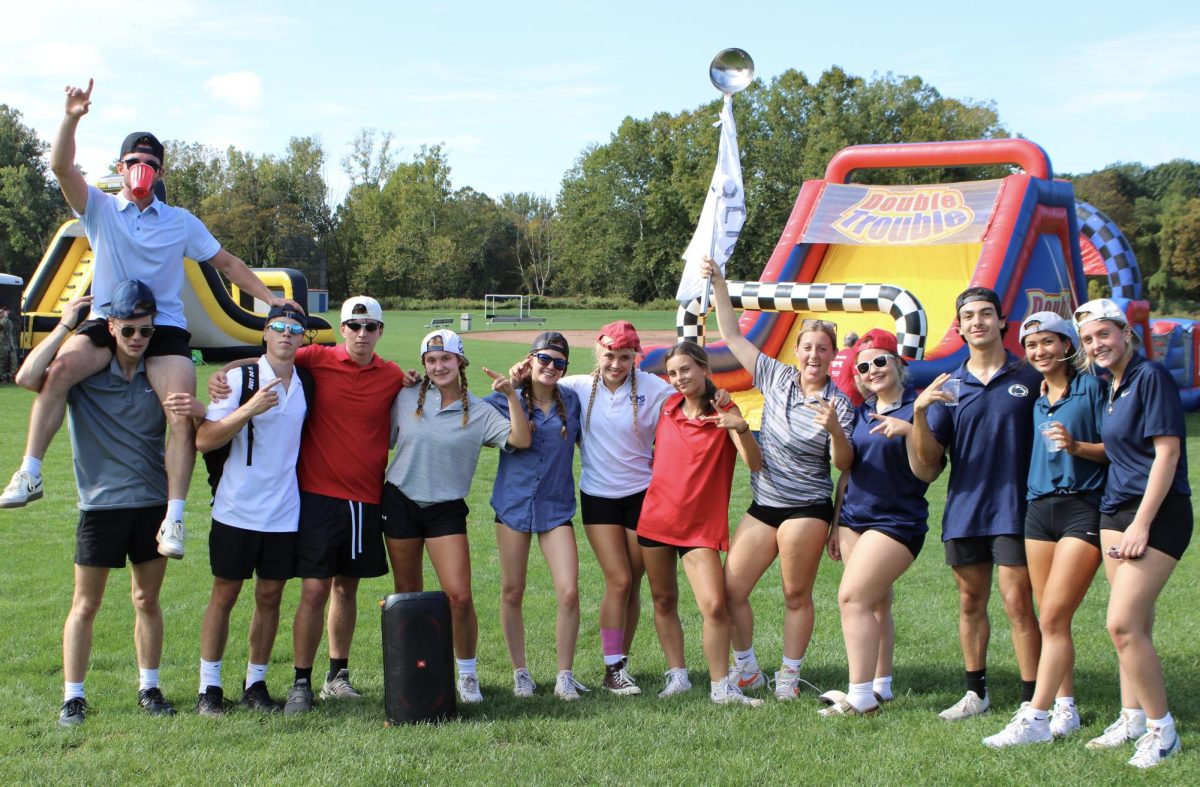 Seniors from left Brayden Whipple, Henry Keil, Jake Cenatiempo, Nick Sniffin, Maia Colavito, Boe Stokes, Grace Rubacha, Hailey Goldman, Laila Jones, Mariah Manzano, Scott Viveros, Sophia Garguilo, and Deme Jones pose for a picture of their team on September 26th.
