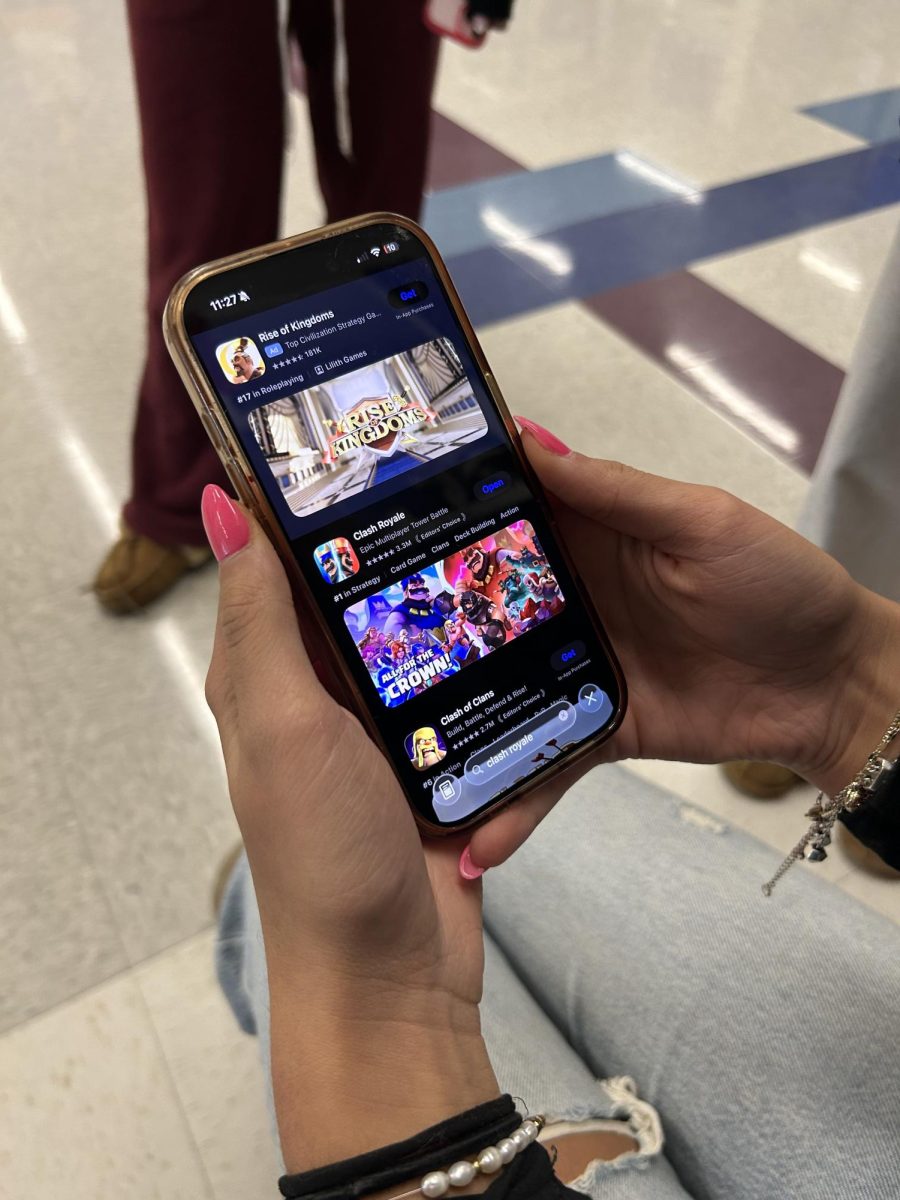 Junior Audrey Doran gets ready to make an account after just downloading Clash Royale. Recently many Nonnewaug students like Doran have made Clash Royale accounts. 
