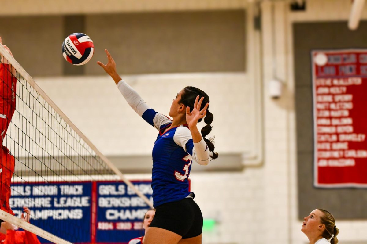 Lana Zupnick prepares to spike the ball on Oct. 8 at the USA themed Volleyball  game against Northwestern. The Chiefs won 3-0.