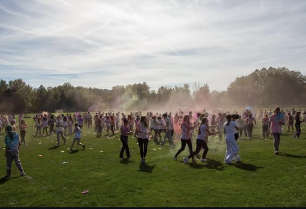 Nonnewaug High School students cover the field in clouds of colorful powder during the color blaze on October 3rd, 2025.