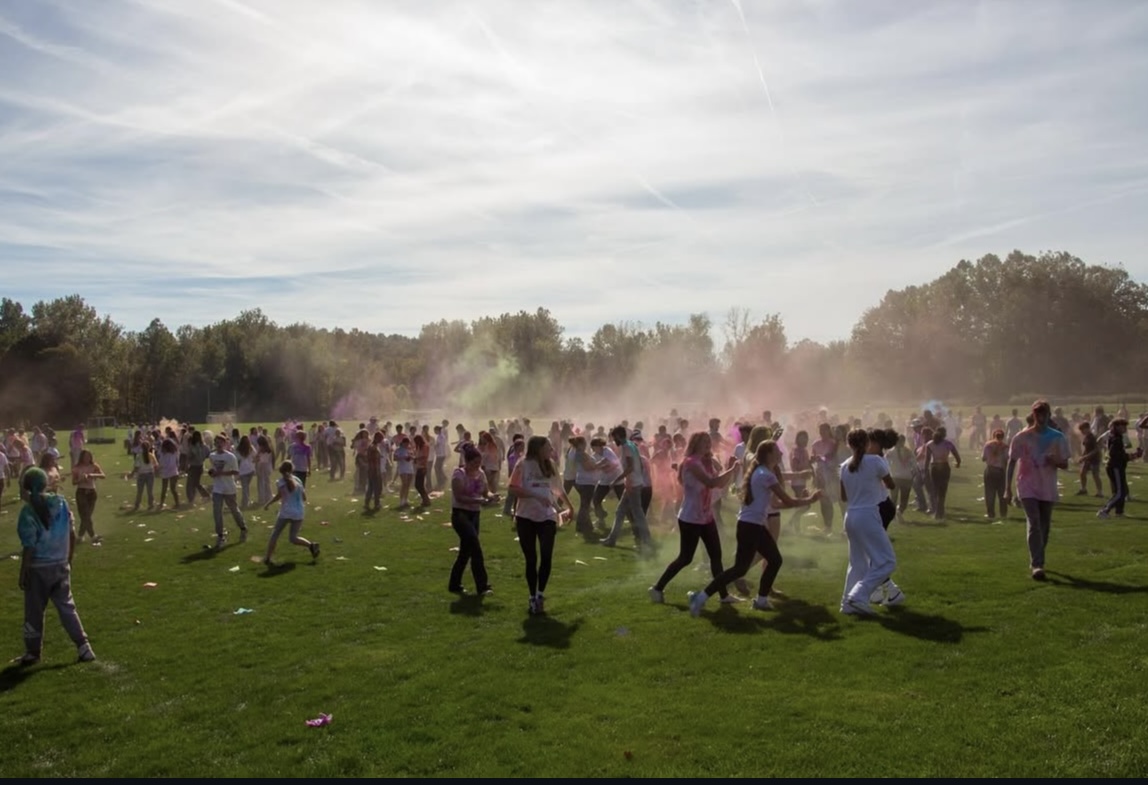 Nonnewaug High School students cover the field in clouds of colorful powder during the color blaze on October 3rd, 2025.