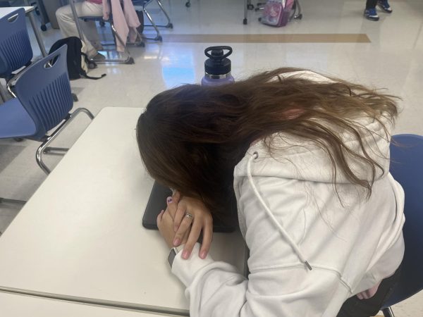 Freshman Madelyn DeGruttola has her head down in class. Increasing numbers of absences on block days due to illness has become a growing issue at Nonnewaug.