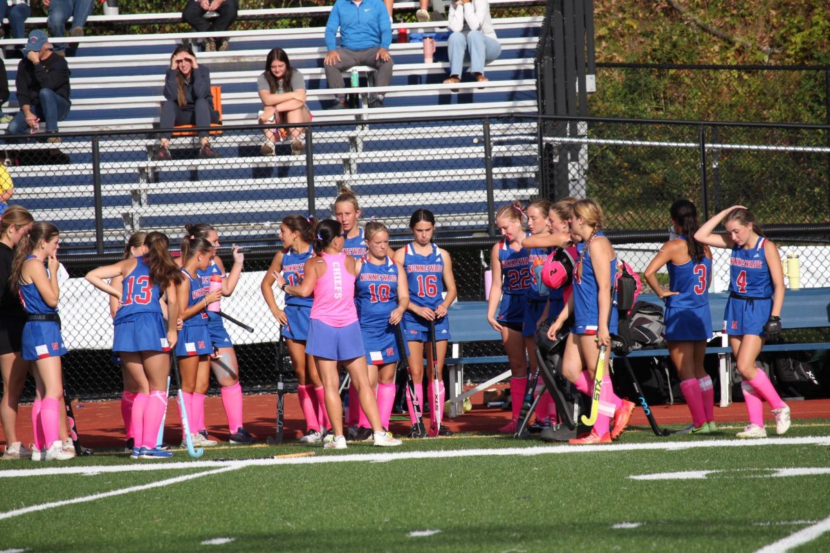 Nonnewaug field hockey team regroups during a time out during the Nonnewuag Field Hockey Homecoming game on Oct. 2. The field hockey team looks forward to playing in the states competition.