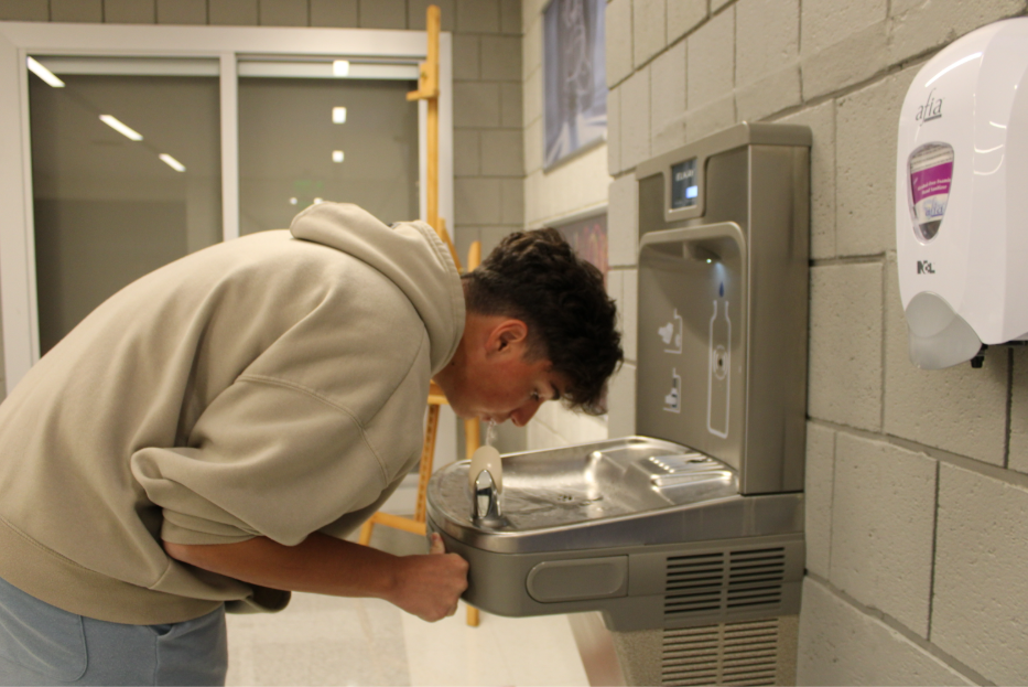Nonnewaug Junior Jorni Kuqi drinking from new water fountain. NHS' two primary filling stations were down during Spring Semester last year. 