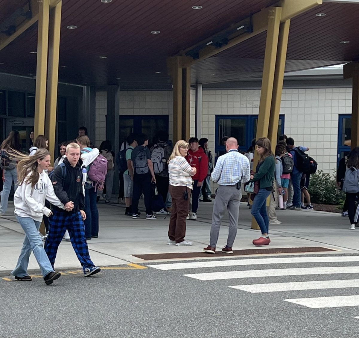 Nonnewaug Students present on a school block day line up to wait for their buses to arrive. Lots of students made an effort to arrive and remain at school for the rest of the day to receive full credit. This school year, block periods count as two class periods, so an unexcused absence counts as a double absence. 