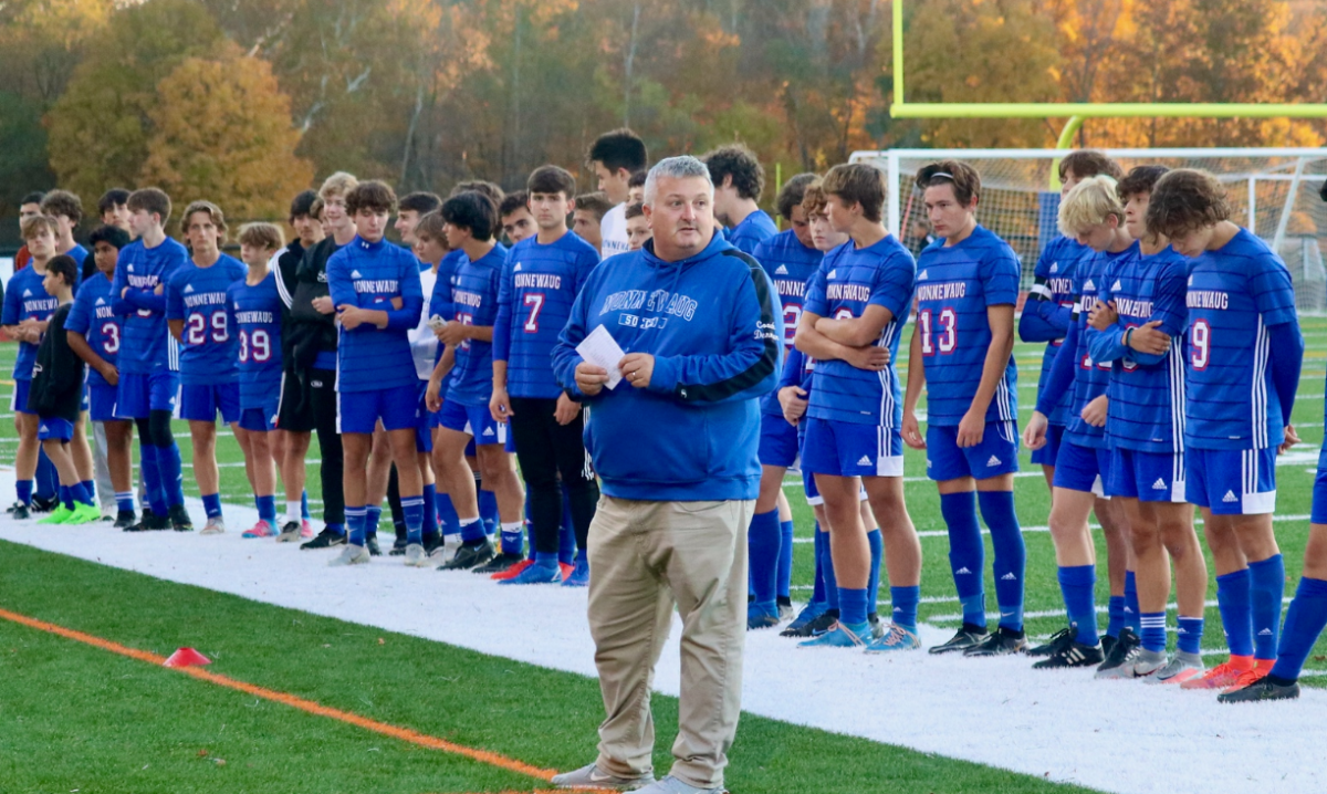 Toby Denman talks to spectators during the 2022 Senior Night soccer game. Over the past 20 years Denman takes every game seriously expecting his team to give their 100% at every game. (photo credit: Noreen Chung) 