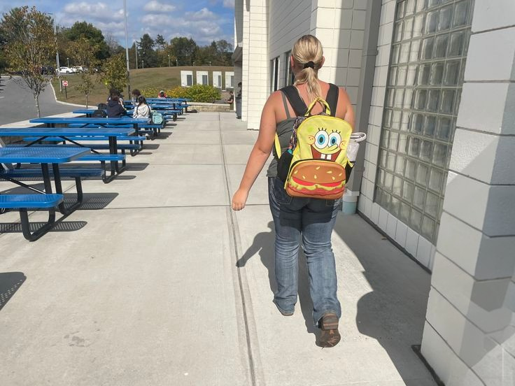 Katelyn Burrier walks with her "Spongebob Squarepants" backpack.