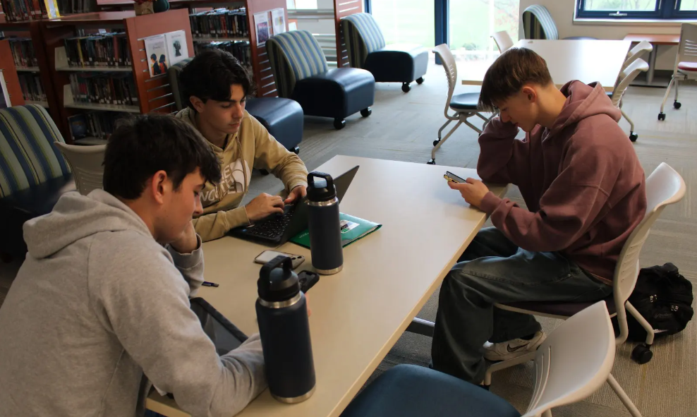 It’s a common sight during NHS study halls: students Scott Viverios, Grant Wilmot, Nic Sniffin. Our current generation is marked by a reliance on technology that’s become our necessity rather than a luxury.