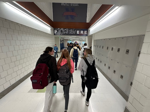 Nonnewaug students make their down a crowded hallway. Slow walkers make it impossible to navigate the halls. 
