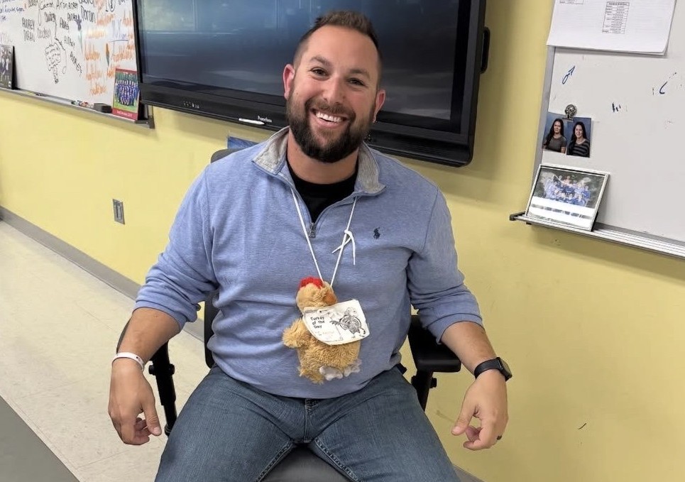 Josh Kornblut poses with the Reply-all Turkey on October 24th. Kornblut as well as other teachers make the mistake of replying all to their email for everyone to see. (Courtesy of Toby Denman)