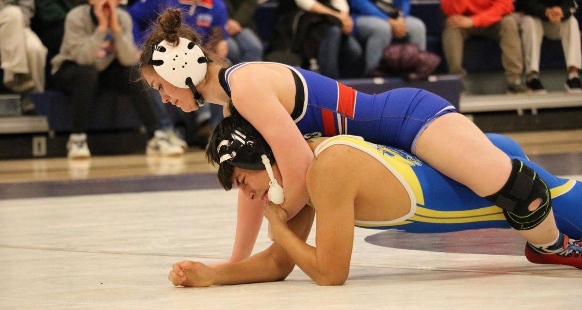 Female wrestlers in Connecticut face a variety of struggles within the sport, ranging from finding opponents to acquiring a uniform. With more female wrestlers becoming interested in the sport, the need for opportunities is growing. (Photo Credit: Lauren Francione)
