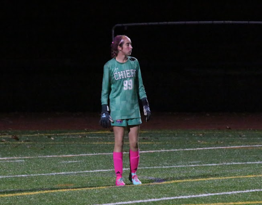 Nonnewaug goalie, sophomore Jocelyn McDougall, directs her teammates from the box, at Nonnewaug's annual Pink Out game. 