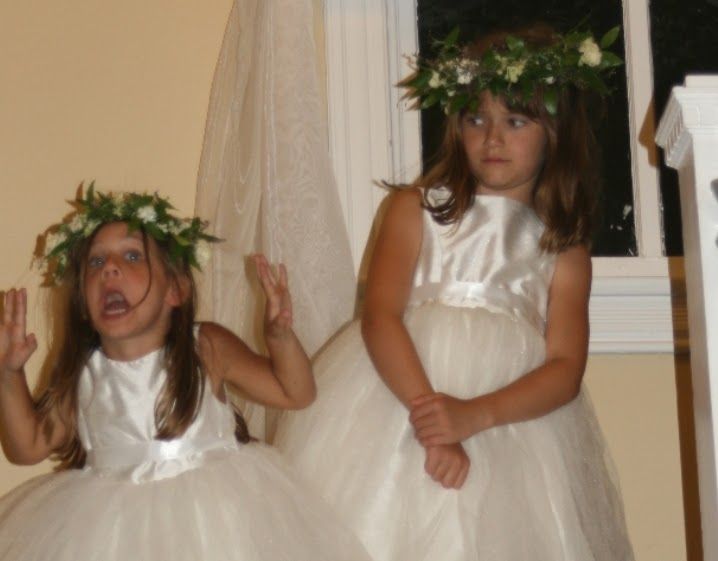 Freshman Sam Savulak (left) and Senior Editor Katie Savulak wear matching dresses at a wedding in 2017. Owning similar or matching outfits limits the amount of cross-wardrobe stealing that occurs between sisters. (Courtesy of Joy Savulak)