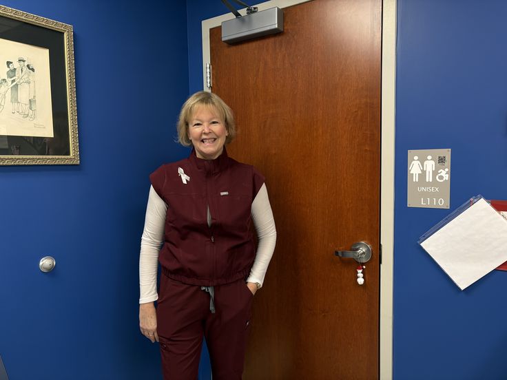 Nonnewaug High School’s nurse, Sandy Snabaitis, stands in her uniform in her office where she spends her days caring for the students. She is a nurse during the school day, but later in the afternoon she becomes Nonnewaug's Leo Club advisor where she advises students on their leadership journey. 