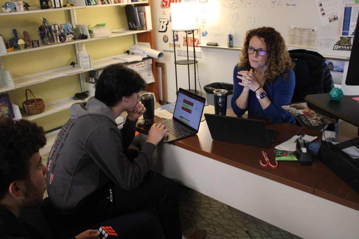 Kathy Green sitting with stressed students navigating them through their application process. With a new semester starting Monday, NHS faculty are working diligently to keep seniors focused on prepared for graduation and beyond.