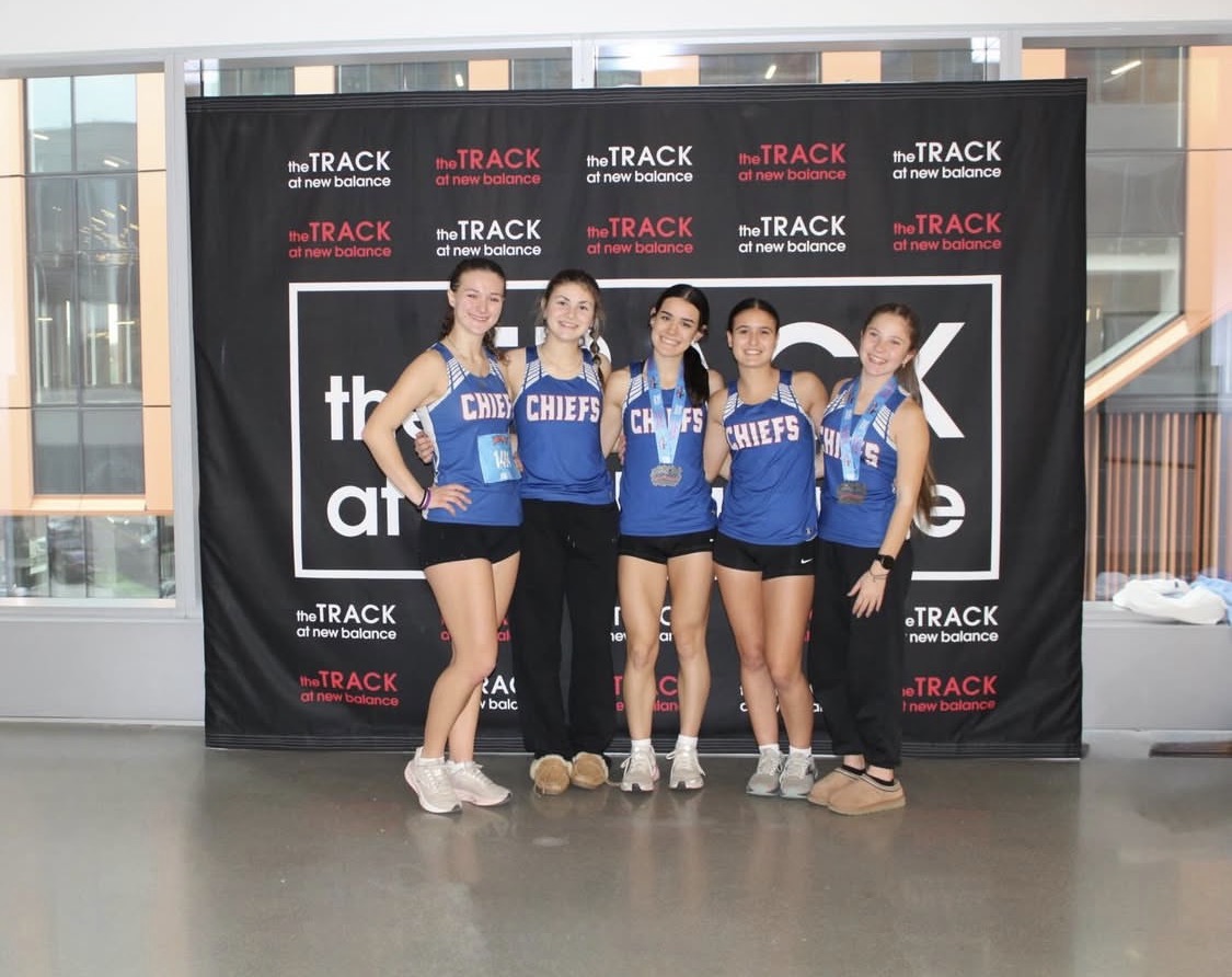 From right to left: Flora Frangu, Tatum Kociszewski, Maddie Garguilo, Gianna Desjardins, and Thea Oleynikov all smile for a picture after the New Balance meet. This opportunity allowed for the girls to complete outside of Connecticut. Both boys and girls indoor track will look to continue their success on the road Thursday, January 22nd for a meet at Hillhouse. photo credit: contributed) 