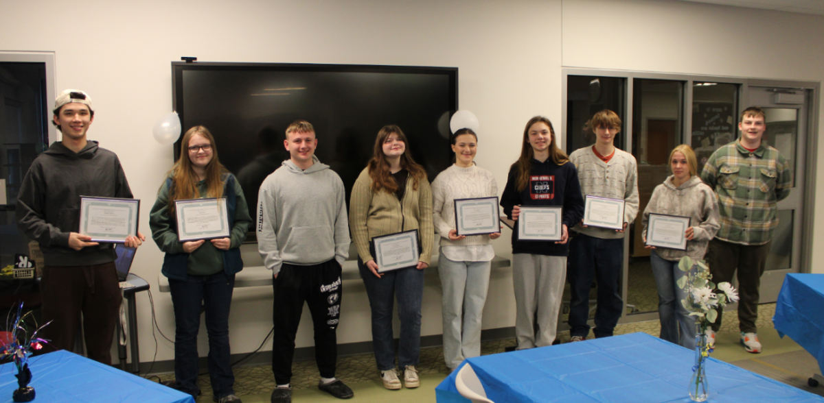 NHS students pose with 'Chiefs with Character' achievements awarded to them on January 28th. This award is given to students who are nominated by teachers who recognize their great immeasurable contributions to NHS. (Photo Credit: Chief Advocate Staff) 