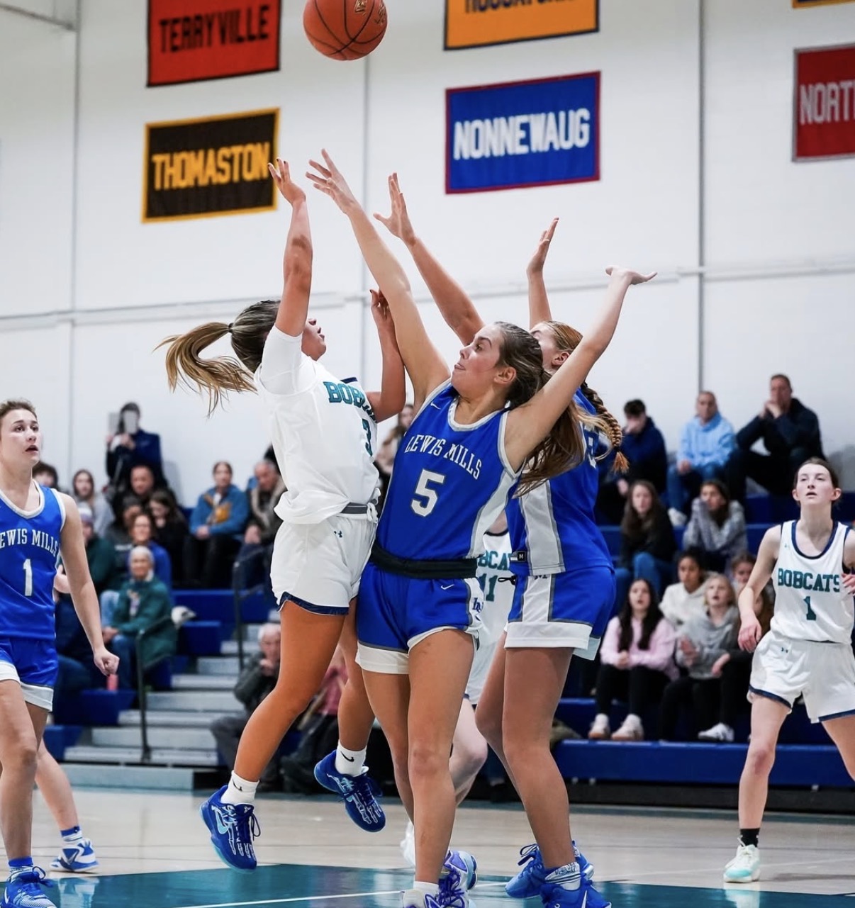 The Berkshire League’s newest edition Lakeview plays against former BL opponent, Lewis Mills in a heated girls basketball game in 2024. Litchfield and Wamago's merger and Lewis Mills’ absence has inevitably shrunk the size of the league, leaving other schools with no choice but to confront the possibilities of league changes. (Photo Credit: Instagram/jaymarqstheshot)