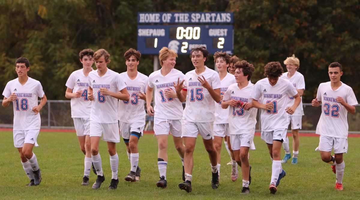 The Nonnewaug boys soccer team celebrates together after they defeat rival Shepaug 2-1 in 2022. The Berkshire League withholds fierce rivalries, championships, and traditions that create an electric atmosphere at every BL game. (Photo Credit: Noreen Chung)