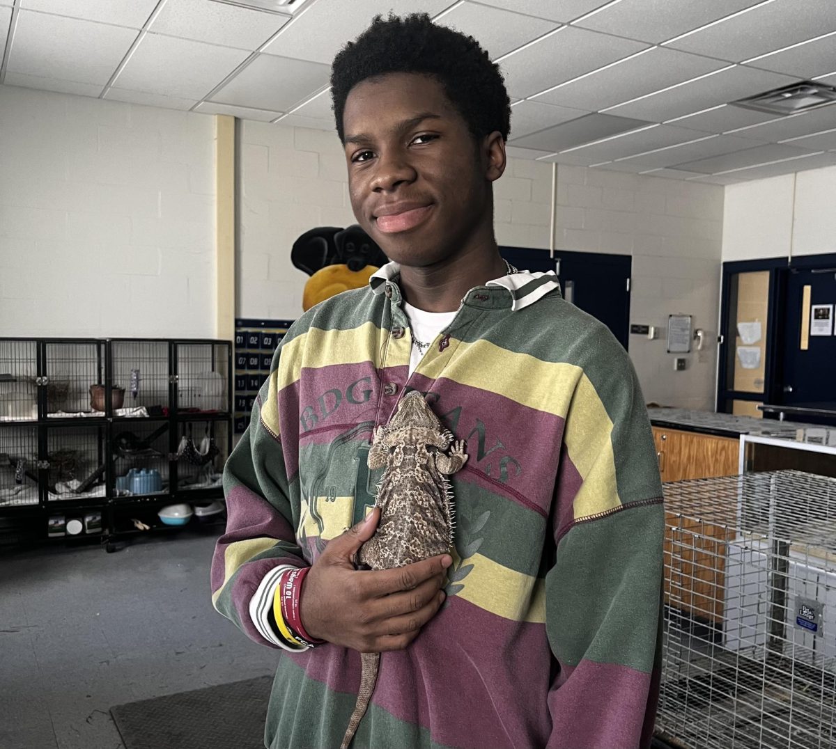 Micah Maberry holding his favorite lizard, Daenerys. Maberry's connection to reptiles comes to life when he visits the vet lab in agriscience.